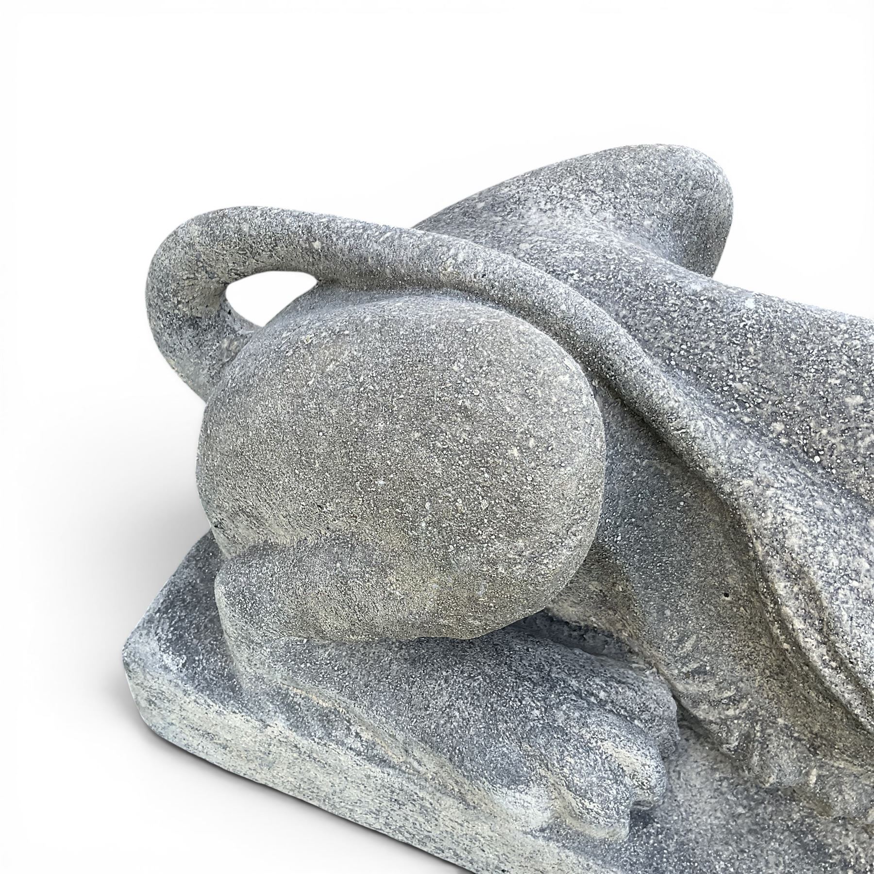 Pair of large cast stone recumbent garden male lions, modelled with flowing manes and raised heads with closed jaws, on rectangular plinth bases