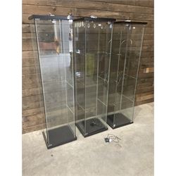 Three Ikea rosewood finish illuminated four glass shop display cabinets, with shelves and keys