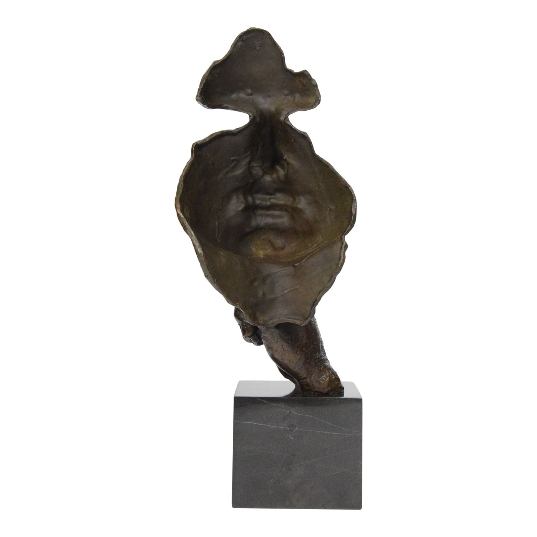 After Salvador Dali (Spanish 1904-1989): The Silence, bronze figure of face with finger raised to lips, H48cm