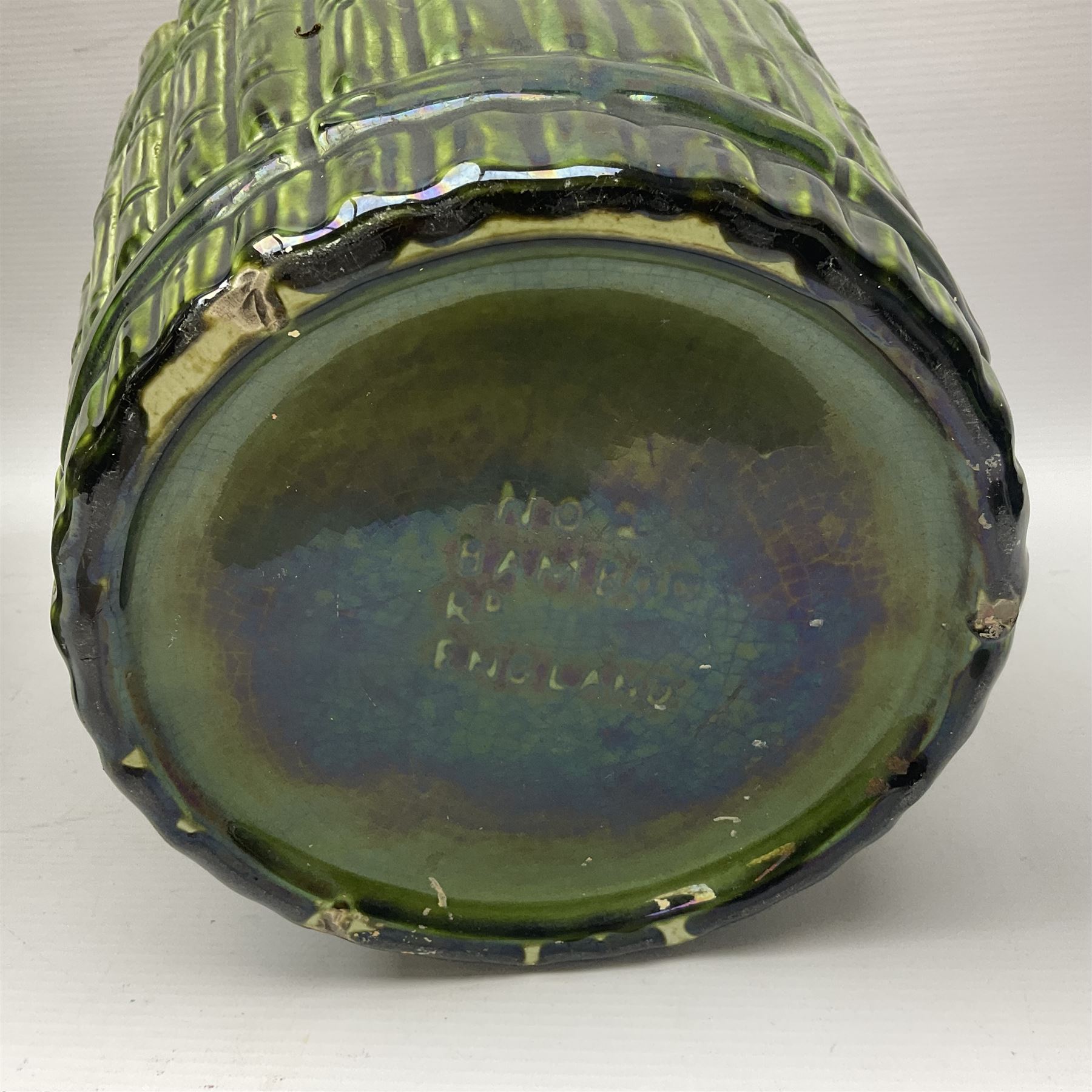 Jardiniere and stand, the jardiniere modelled as a pale, the stand with foliate and foliage decoration on a green ground, stand H73cm 