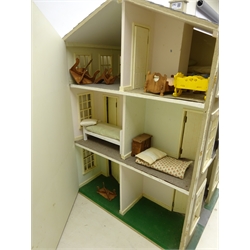  1930s Tri-ang No.1 Princess dolls house based on the Welsh Cottage 'Y Bwthyn Bach' L76cm x H60cm with some furniture and a three storey children's dolls house with some furniture, H83cm (2)  