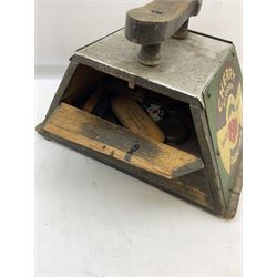 Cherry Blossom Shoe Polish shoe shine box, of sloping form, with three pictorial enamel panels advertising dark tan, black and light tan polishes, the reverse with a hinged compartment, the top mounted with a handle and foot rest in the form of a shoe sole, H29cm W42cm D33cm