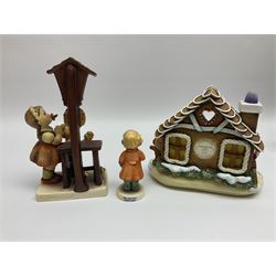 Eight Christmas Hummel figures by Goebel, to include Wintertime Chapel candle holder, Winter Fun, Christmas Morning, Christmas Time and Gingerbread Lane, tallest H21cm