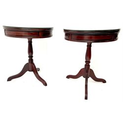 Pair Chinese rosewood drum tables, two drawers, turned column on fluted shaped supports 