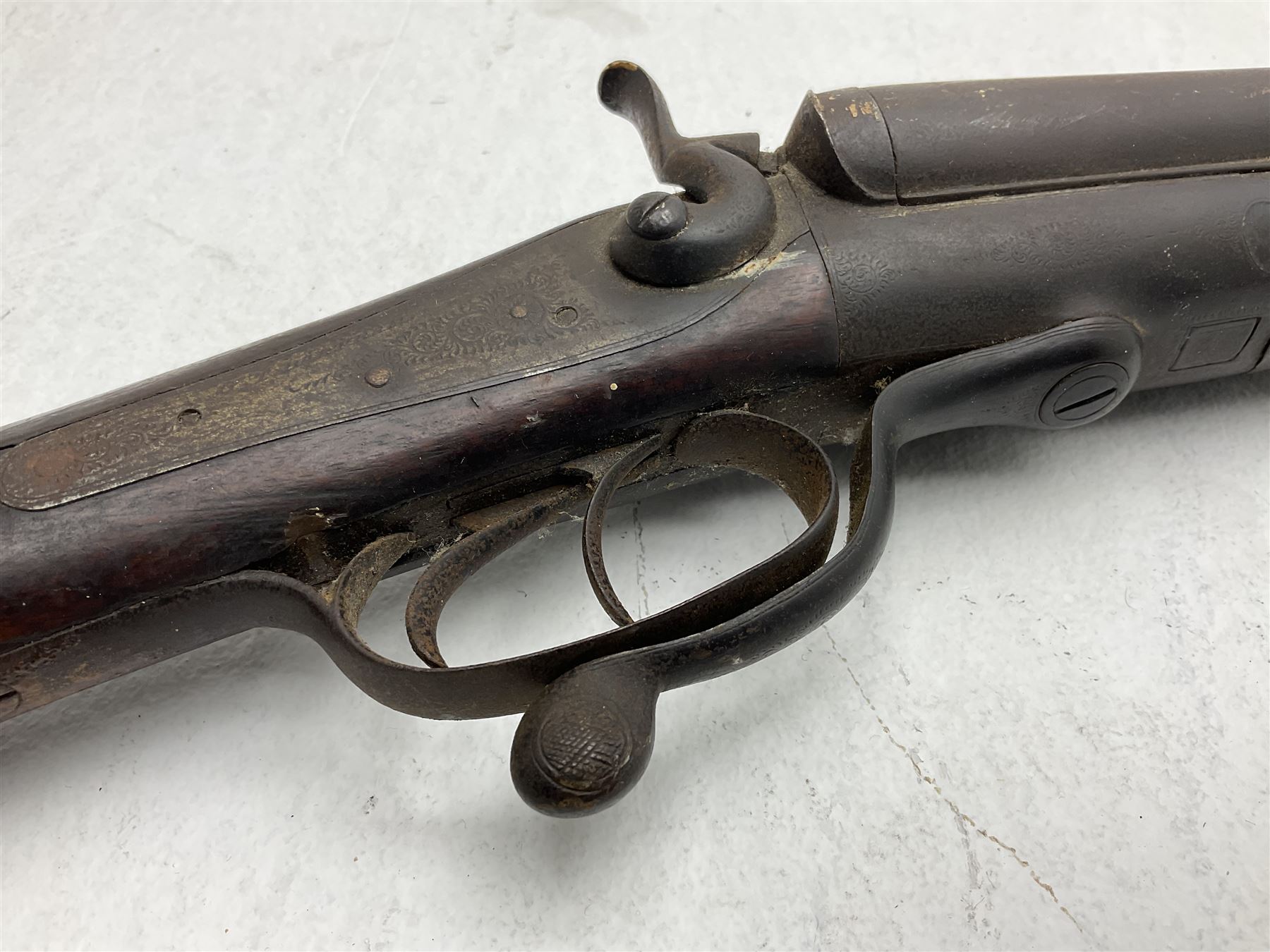 WW1 Lee Enfield SMLE .303 bolt action rifle with 63.5cm barrel and magazine; No.20934; L112cm overall; home deactivated by welding down bolt and end of barrel so requires re-deactivation to modern standards; and 19th century 12-bore double barrel hammer shotgun with 65cm cut-down barrels, non-rebounding hammers and under-lever opening, the lock-plate indistinctly inscribed G.T. Bartrant(?) L75cm overall; home deactivated by welding both barrels closed at breech so requires re-deactivation to modern standards (2) RFD ONLY 