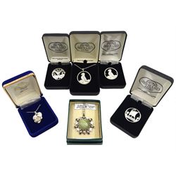 Collection of Scottish silver jewellery including Shetland Silver longship, swan and puffin brooch and a puffin necklace, Iona hardstone pendant necklace with thistle design surround and a 'Jacobite Rose' pendant by Skye Silver, all stamped or hallmarked and boxed 