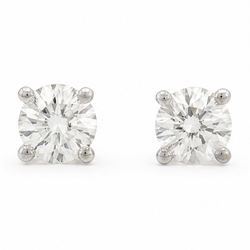 Pair of platinum diamond earrings, each stud four claw set with a single round brilliant c...