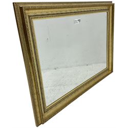 Gilt framed wall mirror with bevelled plate (91cm x 65cm); pair of ladder back carver armchairs (W52cm)