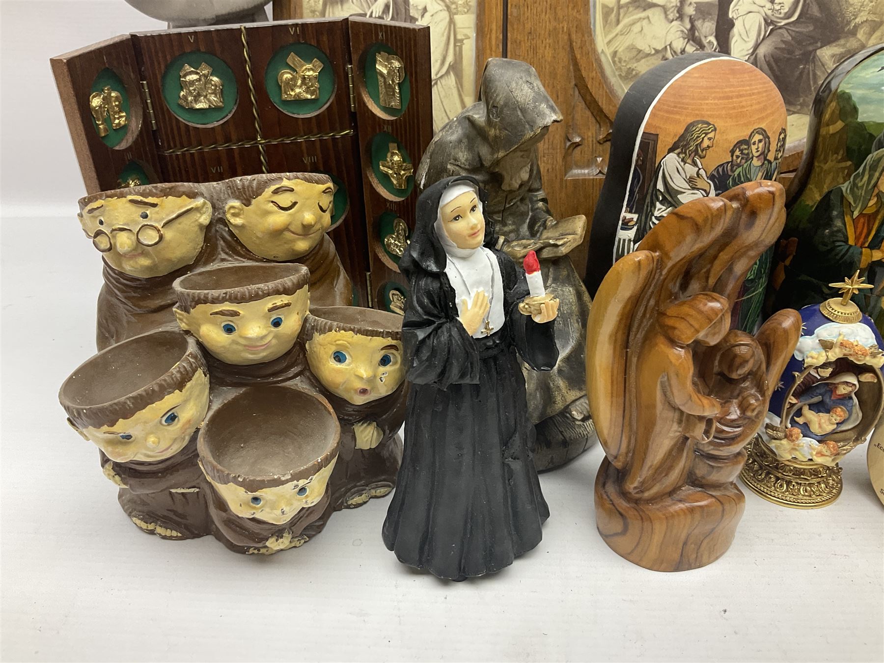 Franklin Mint House of Faberge 'The Nativity' ceramic egg, together with a Russian doll decorated with nativity scenes, Cinque Ports Pottery monk salt and pepper shaker and other monk figures, etc