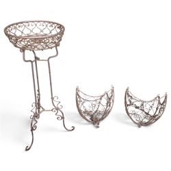 Three wrought iron garden basket planters, comprising a circular pierced and scrolling bas...