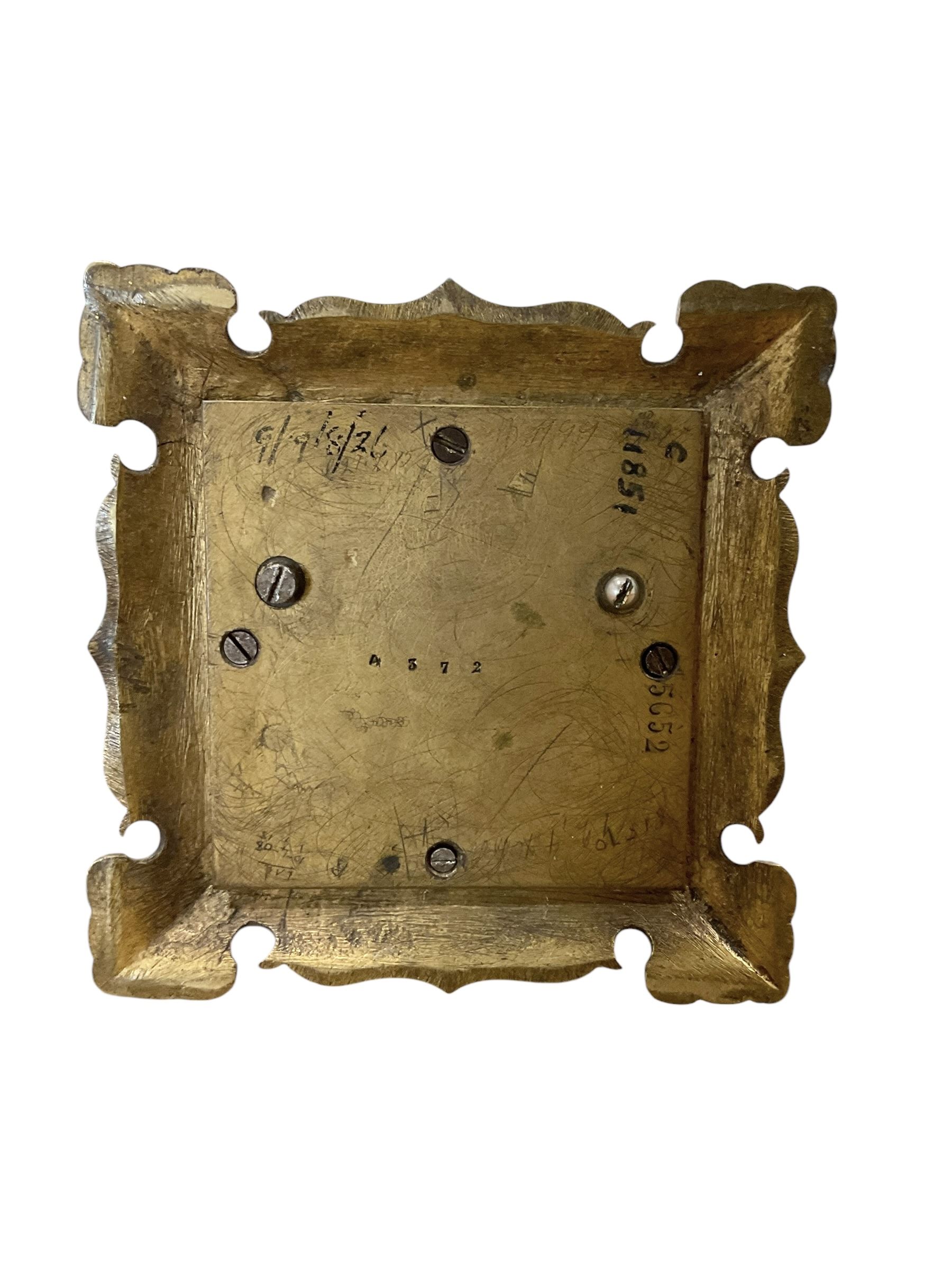 Tiffany- early 20th century brass cased 8-day mantle clock, rectangular case with engraved images taken from classical & mythological fables, with an open strapwork dome, finials to the corners and a cast figure of a standing maiden, case raised on a splayed base with acanthus engraving, enamel dial with Roman numerals, minute markers and steel hands, dial centre engraved Tiffany & Co Paris, twin train French movement with a platform escapement wound from the rear, baseplate of case stamped with the serial numbers 4372 & 5652. With key. 
Provenance from Chatsworth House, Derbyshire.