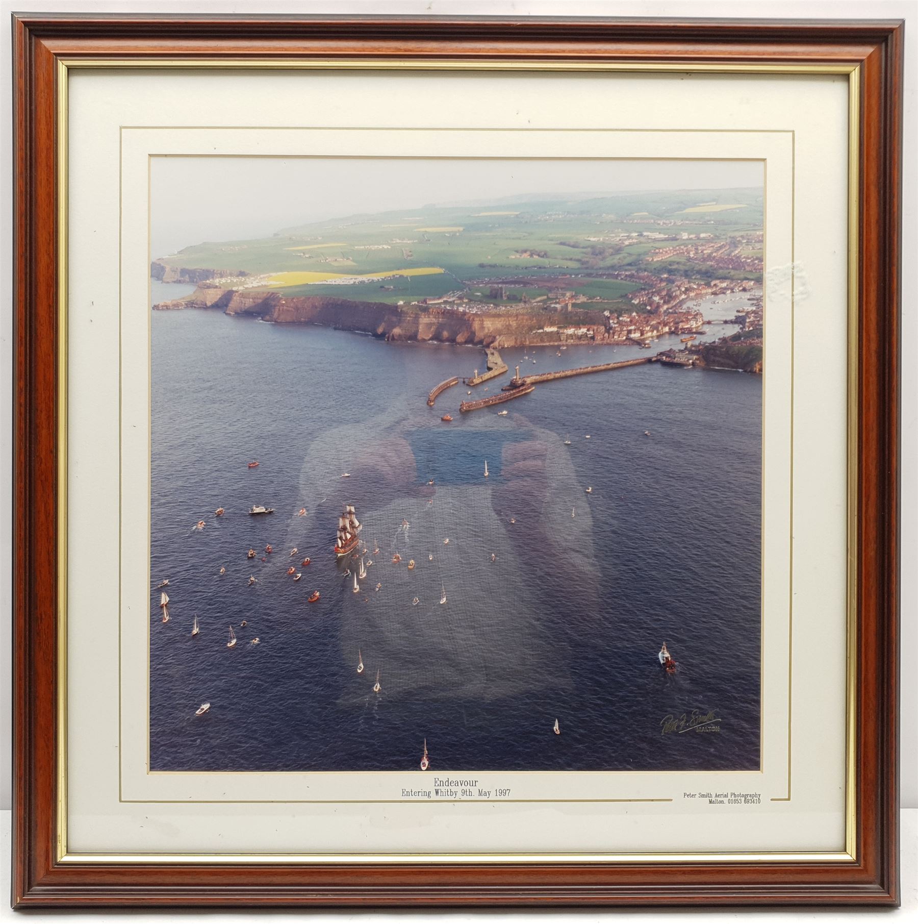 Harry Berry (British 1905-1994): Leith Trawler 'Netta Croan' Aided by the Aberdeen Lifeboat, oil on canvas signed, dated 1974 verso 55cm x 80cm, together with a photograph of the Endeavour returning to Whitby 39cm x 39cm (2)