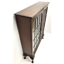 Early 20th century display cabinet enclosed by two astragal glazed doors, three adjustable shelves, cabriole legs