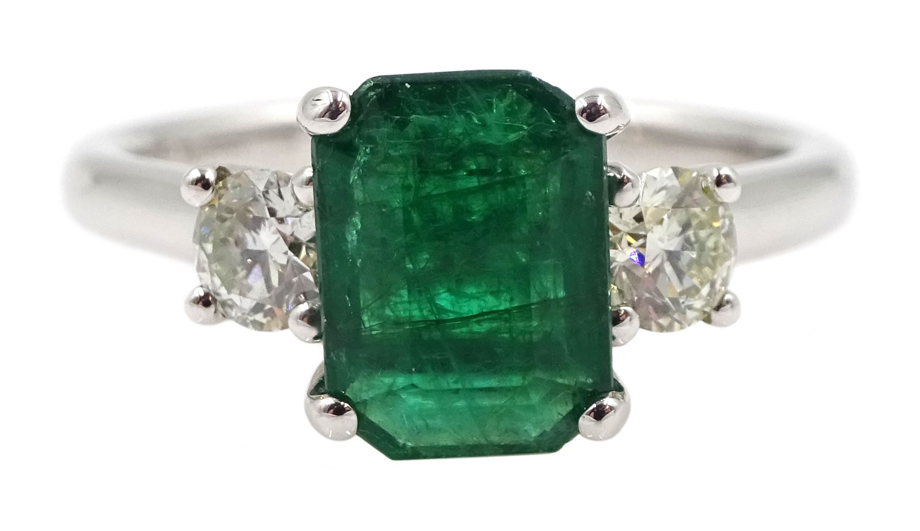 18ct white gold emerald and diamond three stone ring, hallmarked, emerald 1.16 carat, total diamond weight 0.39 carat, with World Gemological Institute Certificate 