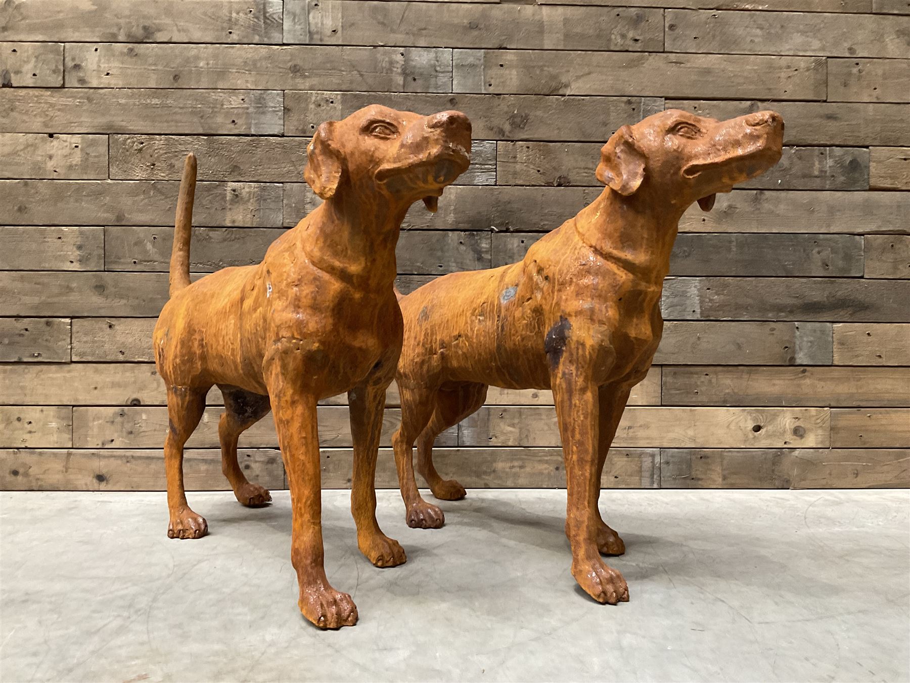 Pair of life-size heavy cast iron garden Hunting dogs