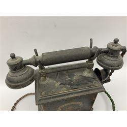 Early 20th century Danish desk telephone inscribed The Ericsson Bell Telephone Co. Glasgow to one side and Aktieselskabet Electrisk Bureau Kristiansand to the other, ebonised wooden top with handset on brass cradle. black japanned tin centre section bearing Hull Corporation Telephones Department crest, side cranking handle and ebonised wooden base H30cm  