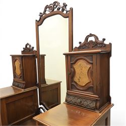 Edwardian figured walnut dressing chest, with central tilting mirror with pierced fret work, flanked by cabinet with figured walnut panelled door above a trinket drawer, with four short over a long long drawer, raised on a plinth base with castors 