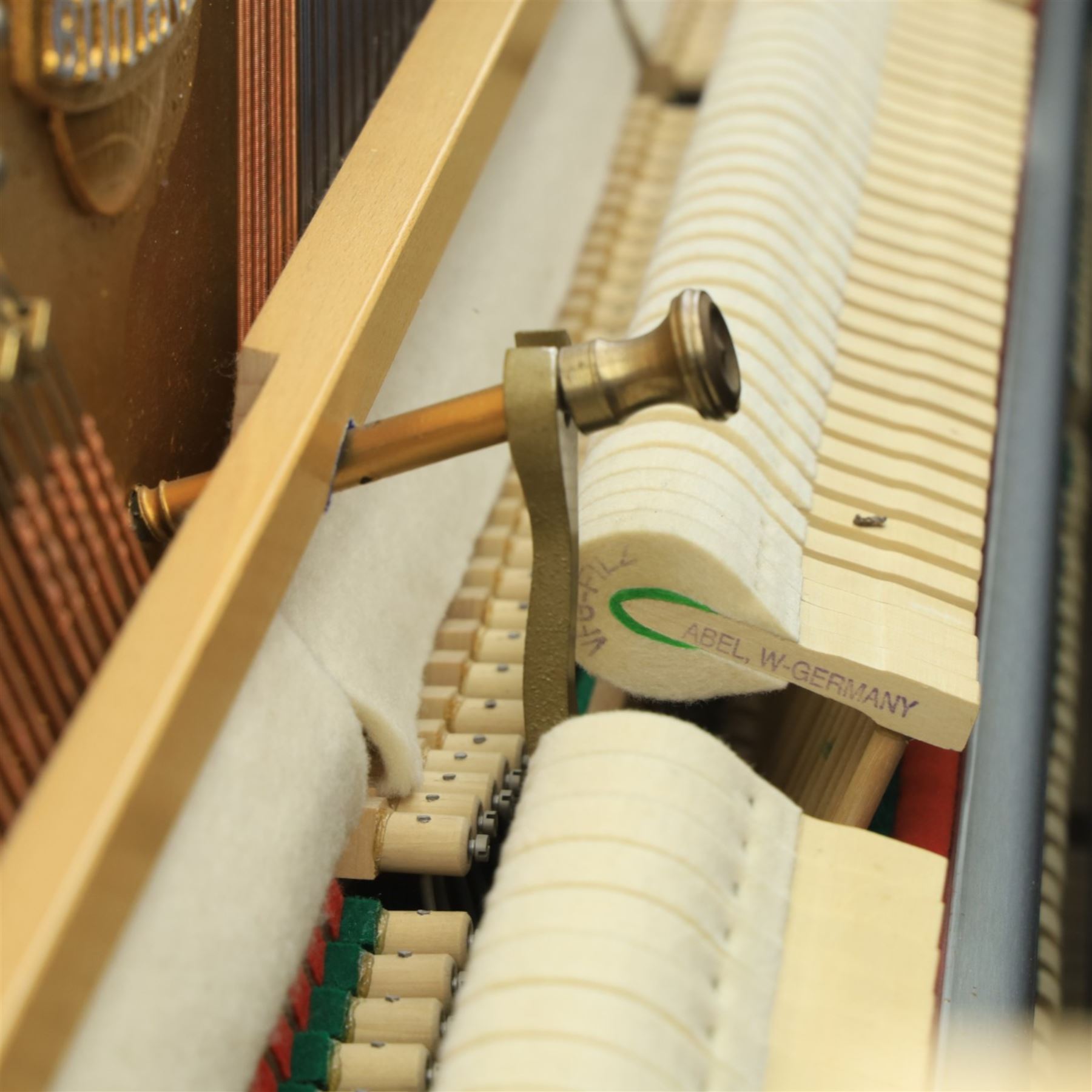 Bluthner of Leipzig upright piano, mahogany case with 88 keys and three brass pedals
