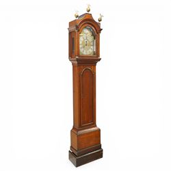 18th century oak eight-day longcase clock,  signed James Smyth, Saxmundham, the arched hood with brass ball and eagle finials, moulded arch pediment over turned columns, brass dial with silvered Roman chapter ring, Arabic minute track, matted centre with subsidiary seconds dial and calendar aperture, engraved boss to arch, the trunk with arched panel door, on stepped plinth base, with two weights and pendulum