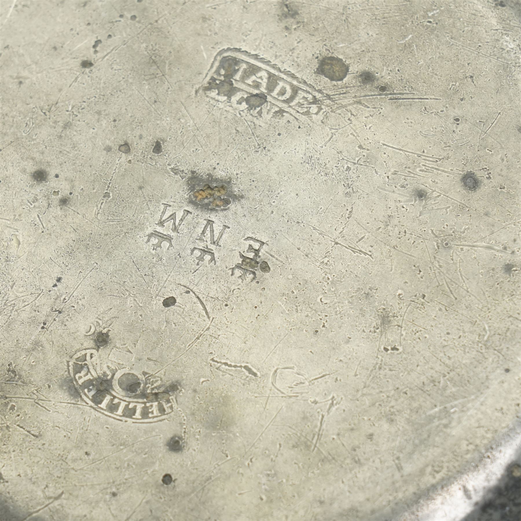 Collection of early 19th century and later British pewter, mostly London label marks, including two large pewter chargers, medicine spoon, flasks, plates and other tableware