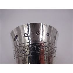 Modern limited edition silver goblet, a replica of the original silver chalice of Lincoln Cathedral, with hand planished decoration, and engraved band of laurel leaves to bowl, with gilt interior, upon waisted stem and circular stepped foot, no. 144/200, hallmarked John Cussell, London 1977, H15cm