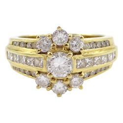 18ct gold round brilliant cut diamond cluster ring, with channel set three row round and princess cut diamond set shoulders, stamped 750