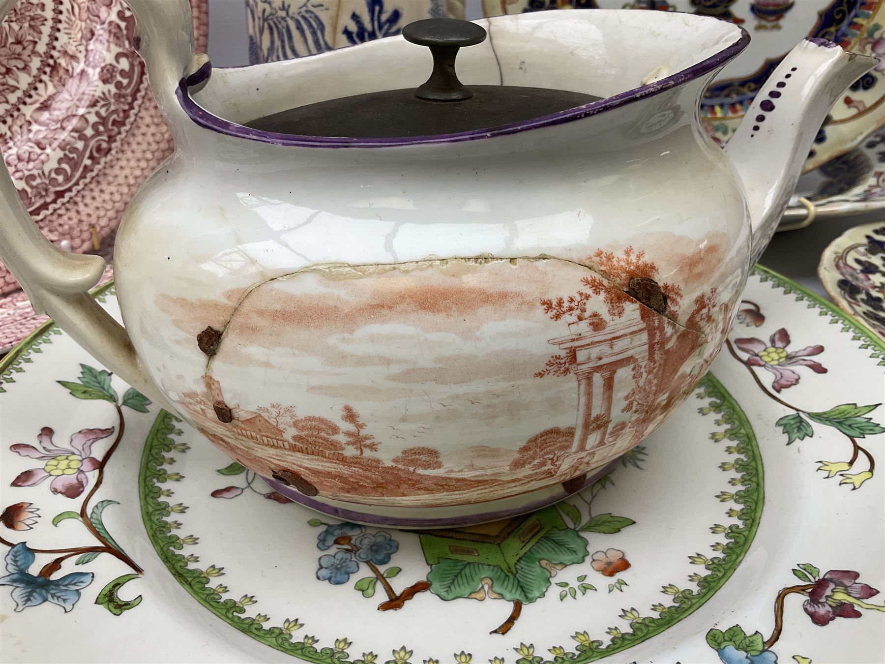 Four mid 19th century Mason's Ironstone plates decorated in the Chinese Antiquities pattern, the central circular panel decorated with footed vase with stylised motifs within a floral border, with gilt detail, pattern no. 1438, largest D26cm, together with Royal Worcester plate with floral decoration within green borders, blue and white tankard with pewter lid and teapot, teapot
