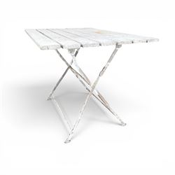 Wrought metal folding garden table, with painted wood plank top; and four matching folding chairs