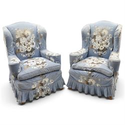 Pair of Queen Anne wingback armchairs, high back over out-swept arms, raised on ball-and-c...