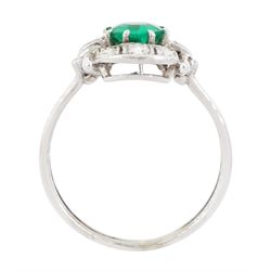 Art Deco 14ct white gold emerald and diamond panel ring, the central round cut emerald of approx 0.45 carat, within a pierced octagonal setting, flanked by a single cut diamond either side and three rows of milgrain set, single cut diamonds, to a reeded shank, stamped 585, total diamond weight approx 0.55 carat