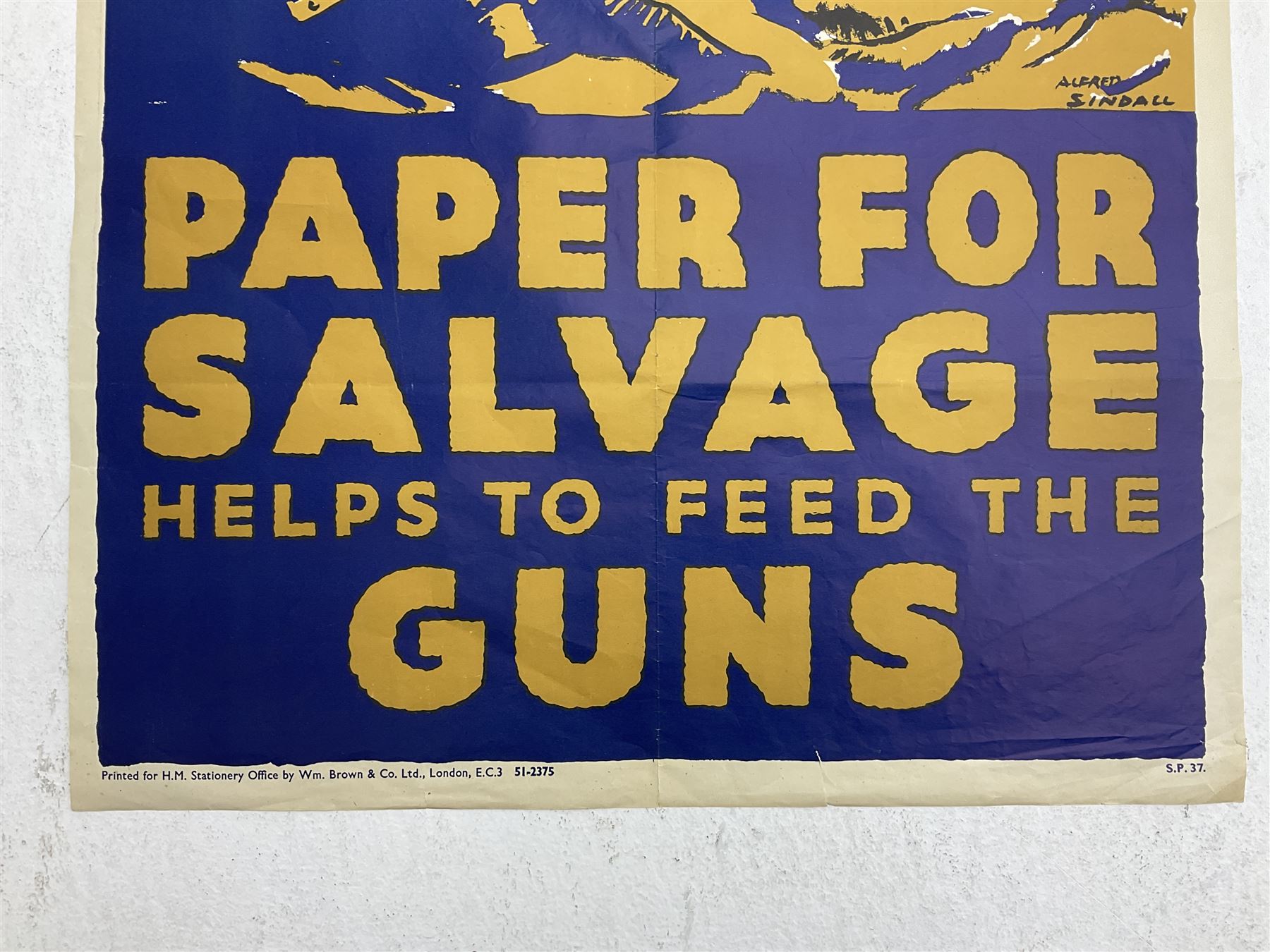WW2 poster after Alfred Sindall printed for H.M. Stationery Office by Wm. Brown & Co Ltd London E.C.3; poster No.S.P.37 'Paper For Salvage Helps To Feed The Guns' depicting British Soldiers firing a field gun 75 x 51cm; blue, gold and white; unframed