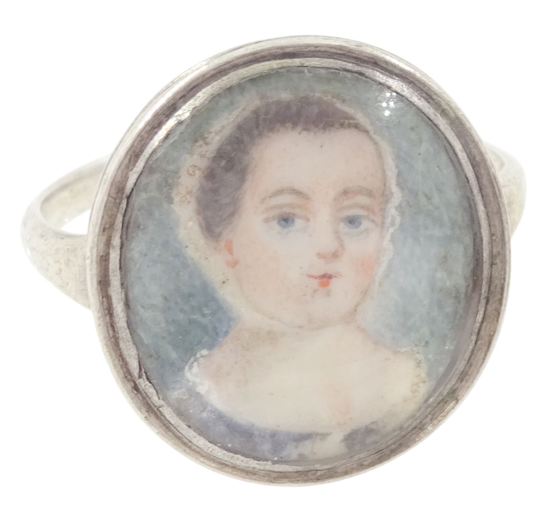19th/ early 20th century silver portrait miniature jewellery including a pearl set pendant painted with a cherub, a ring painted with a young girl wearing a bonnet and brooch with seed pearl surround, all on ivory. This lot has been registered for sale under Section 10 of the APHA Ivory Act