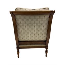 Wesley Barrell - beech framed armchair, upholstered in floral patterned fabric, on turned supports
