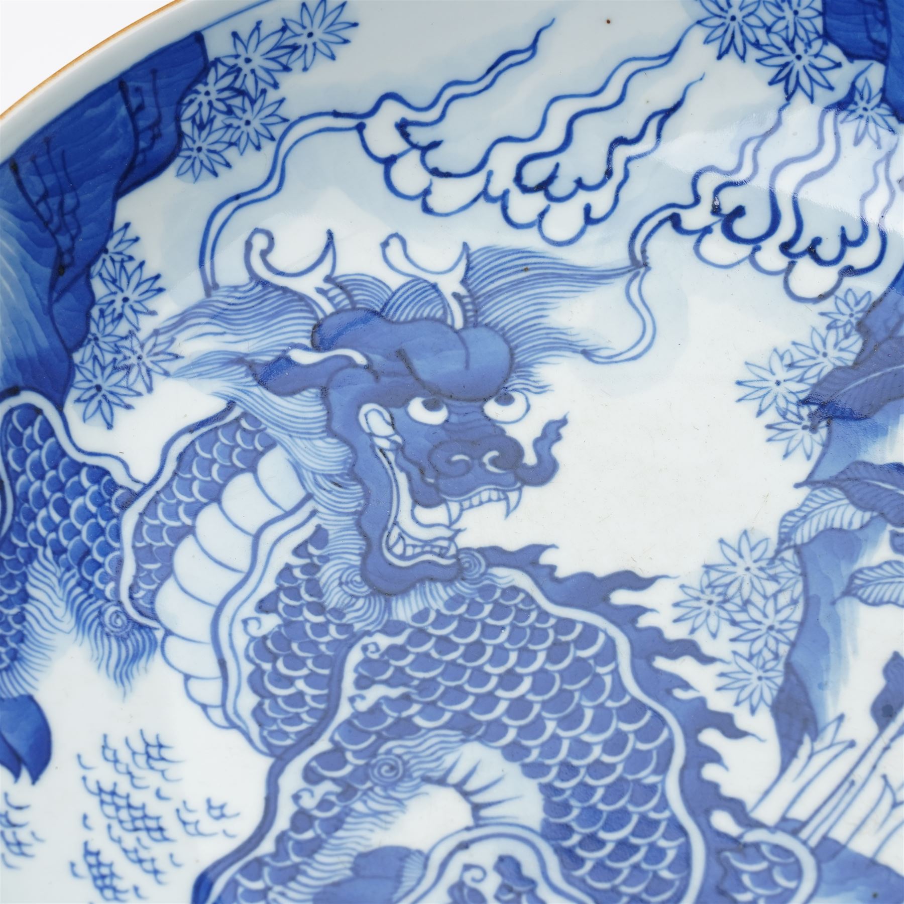 17th century Chinese blue and white charger, decorated centrally with a Qilin, four character mark within double blue ring to base, D34cm