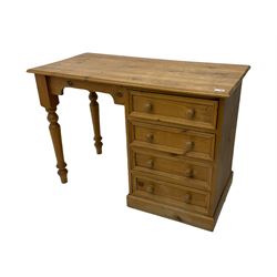 Waxed pine single pedestal dressing table, pine bedside cabinet, bergere chair and a stool