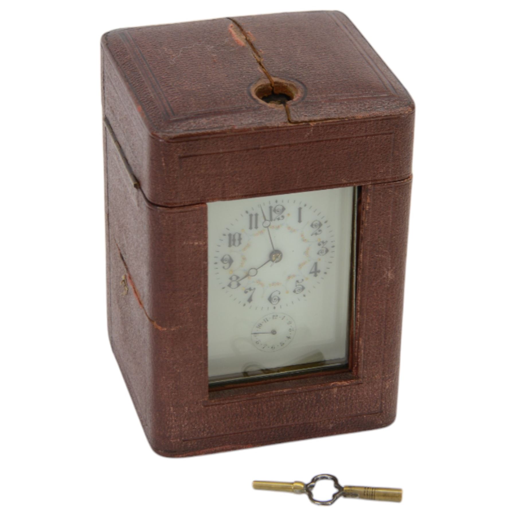 French - Early Edwardian corniche cased 8-day carriage clock, decorative enamel dial with floral garlands, Arabic numerals, minute markers, steel moon hands and conforming alarm setting dial, four rectangular glass panels and an oval viewing glass to the top, with a silvered lever platform escapement and 
timing screws to the jewelled balance, twin train rack striking movement with repeat, sounding the hours, half hours and alarm on a coiled gong.  Original traveling case with viewing glass and key.