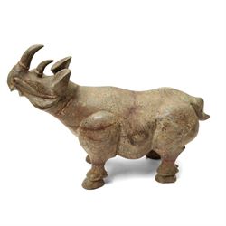 Carved stone Rhino, W44cm and a pair of two green stone Elephants, W38cm (3)