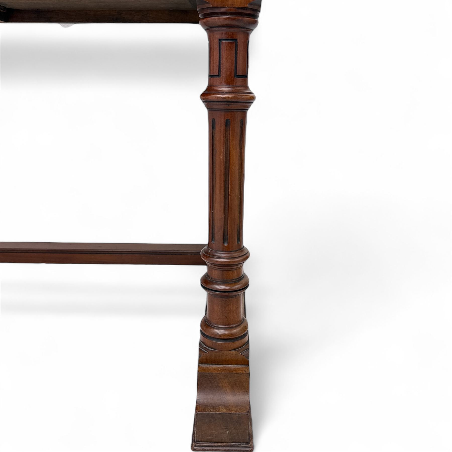 Late Victorian mahogany side table in the style of Gillows of Lancaster, mahogany rectangular top above two frieze drawers, the top edge of the right drawer stamped 'Gillow' and 'L486' with knob handles supported on turned stop and fluted legs with stretcher base on recessed castors

Provenance: The Davies-Cooke Collection from Gwysaney Hall, North Wales  