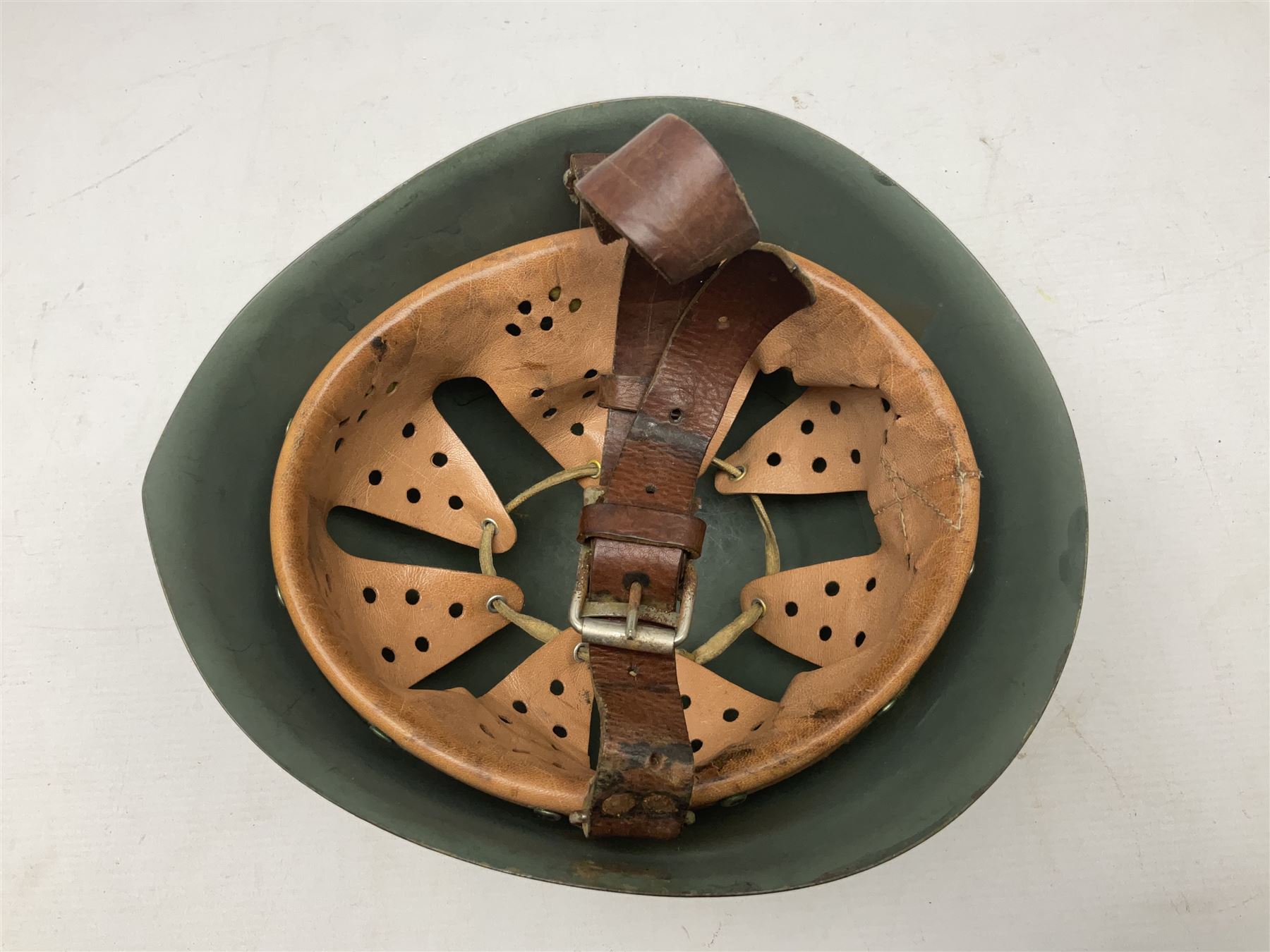 1960s Italian parachutist helmet with liner; camouflage paintwork with parachutist crest to the front