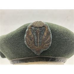 Four paratrooper berets - Russian, Italian, British and Foreign Legion; all with badges (4)