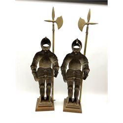 A matching pair of knights, fireside companions, holding halberds, H90cm. 