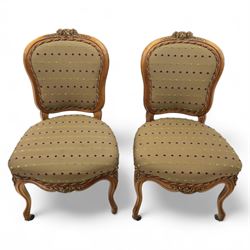 Set of four Victorian walnut framed salon chairs, upholstered in olive fabric with diamond embossed tufts