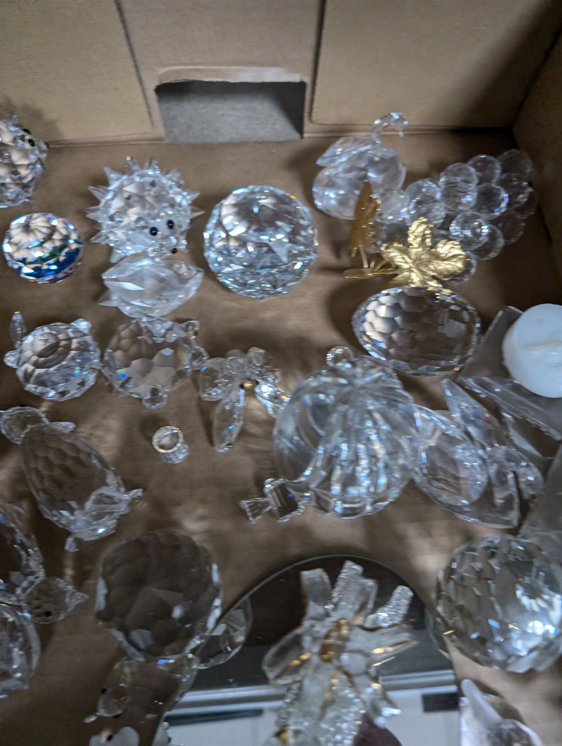 Collection of Swarovski figures, including owls, cats, penguins etc, together with Perthshire paperweight 