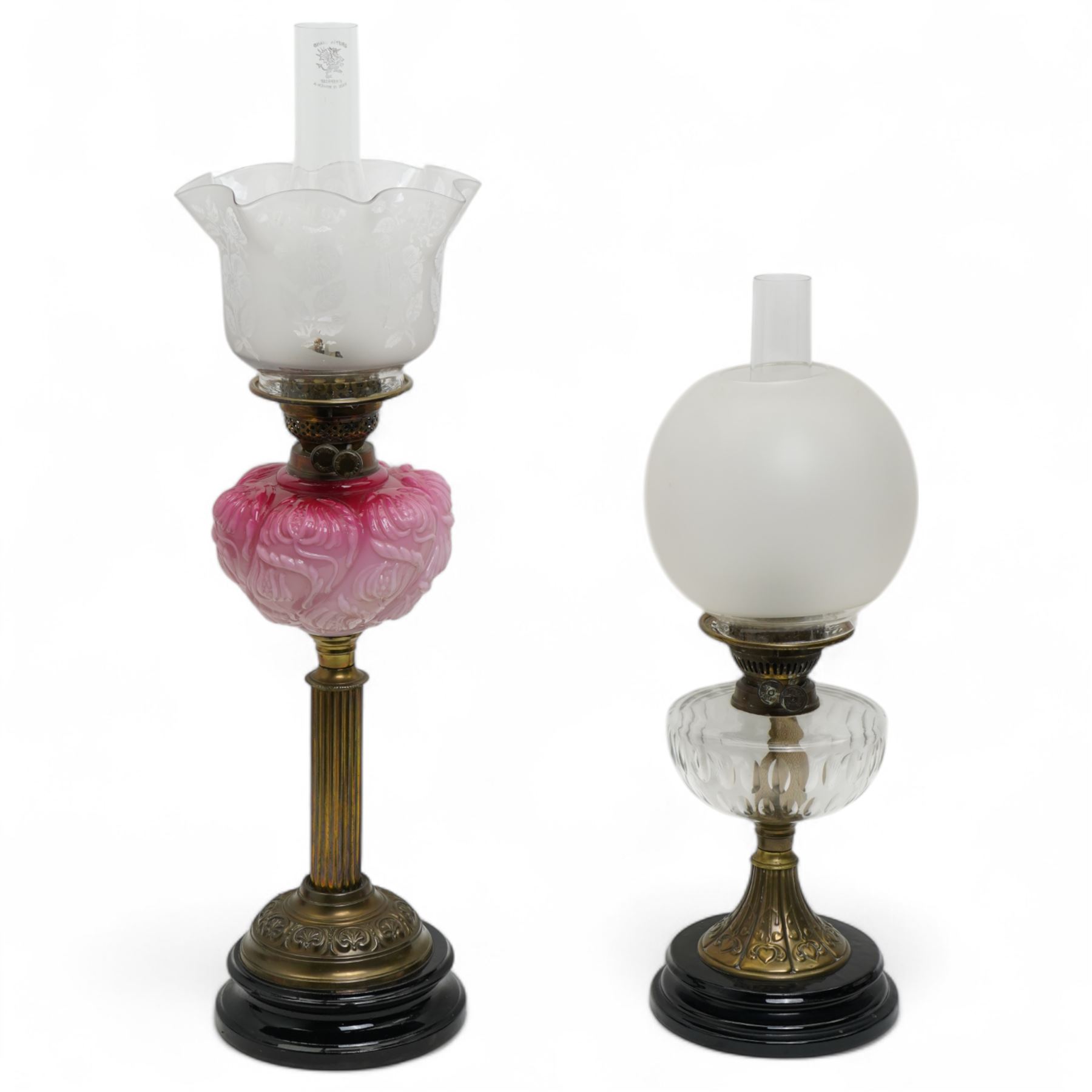 Victorian brass column table oil lamp with pink glass reservoir and etched shade H61cm and a smaller lamp with opaque shade