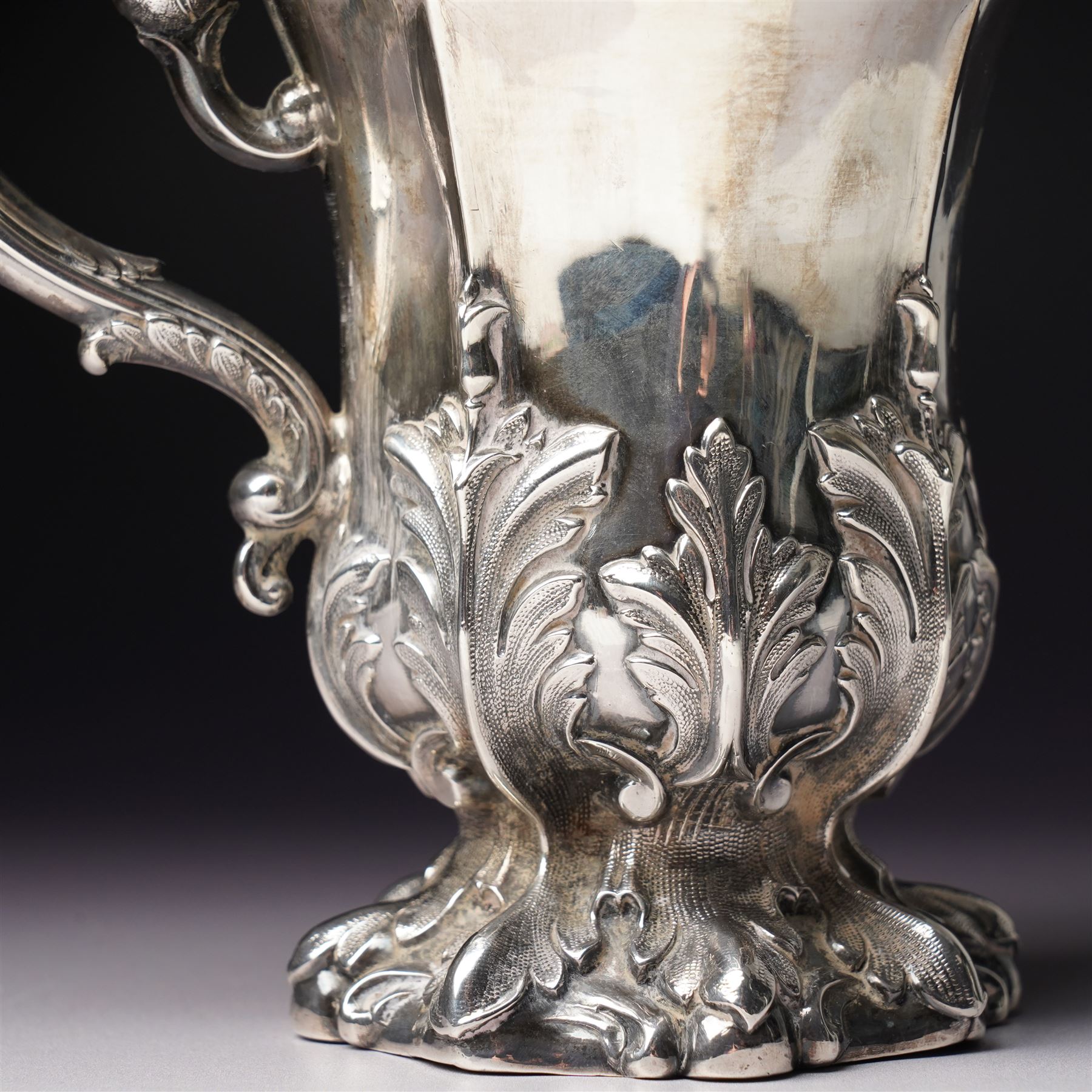 Victorian silver cup with acanthus leaf decoration and scroll handle, H12cm with retailers mark of J Mayer, Liverpool Sheffield 1851Maker Henry Wilkinson & Co