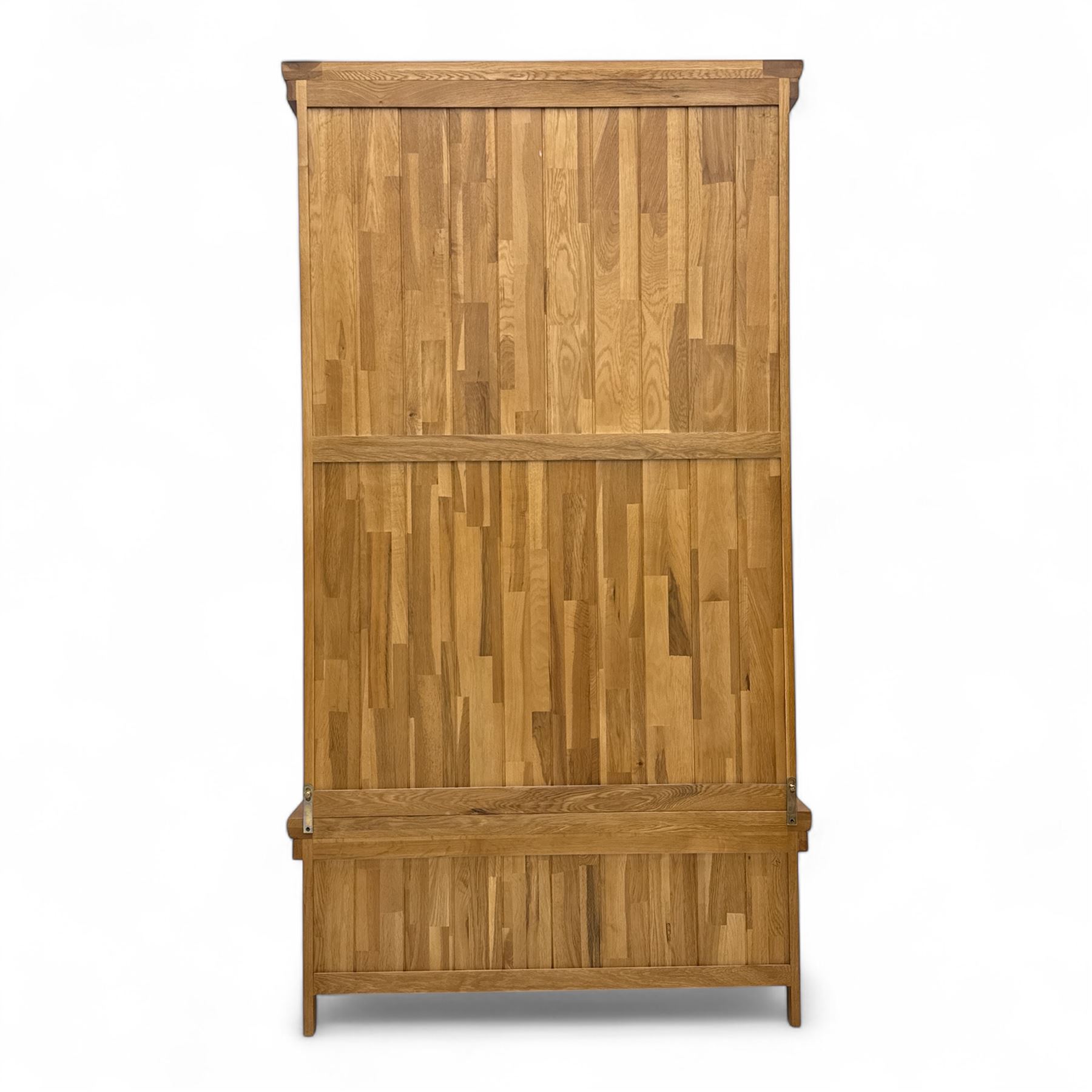 Modern light oak double wardrobe, with twin panelled doors enclosing hanging rail and full-height interior, above a deep lower drawer with recessed handle, shaped stiles