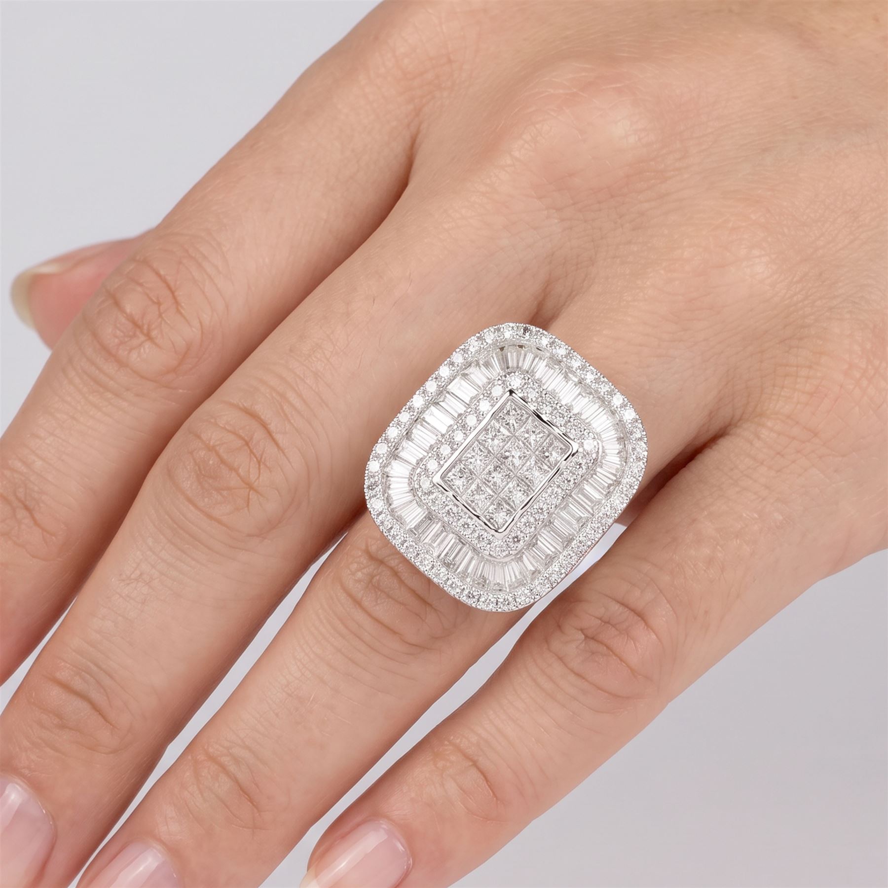 White gold diamond cluster ring, pave set with princess cut, baguette cut and round brilliant cut diamonds, hallmarked 9ct, total diamond weight 3.40 carat