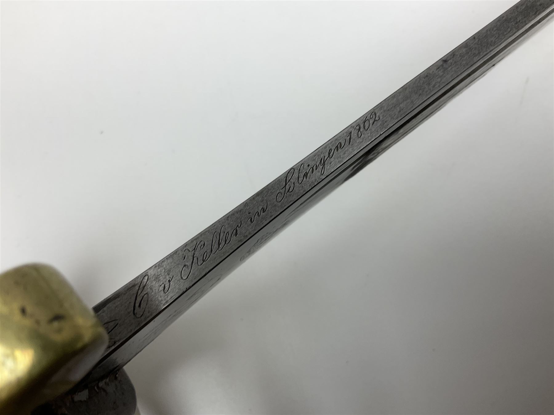 19th Century German (Saxony) Cavalry Sword, the 90.5cm single edge curved steel blade with narrow fuller to the back edge at each side, engraved with a crowned AR monogram and coat of arms, stamped with crowned AR, the back edge engraved C.v Keller im Solingen 1862, the brass half basket hilt with three flat curved bars, applied badge missing, marked G.R. 4, with ribbed leather covered grip and leather finger strap; in steel scabbard with two fixed suspension rings to one side and stamped G.R. II 118; L109.5cm overall