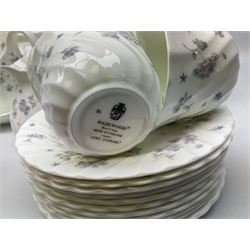 Wedgwood tea and dinner service decorated in the ‘April Flowers’ pattern, to include nine bowls, seven teacups and saucers, three coffee cups and saucers, sauce boat and stand, lidded tureen, covered sucrier and another smaller, oval serving plate, twelve side plates, teapot, four dinner plates, jug and shallow bowl