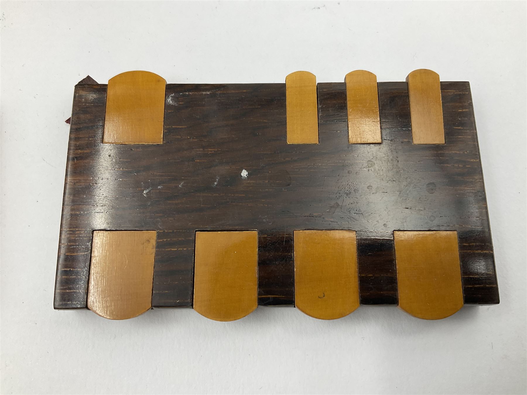 Edwardian silver mounted playing card case, hallmarked William Harrison Walter, Birmingham 1903, the sides each with a period playing card set behind a bevelled glass panel, the hinged cover with later engraving 'Presented to Norman T Crombie Esq by the officers & men of the 31st WR Detachment for services rendered 1917-1918', with red leather lined interior, the three compartments upon a sprung base and containing two later wooden Whist markers, case H12.5cm